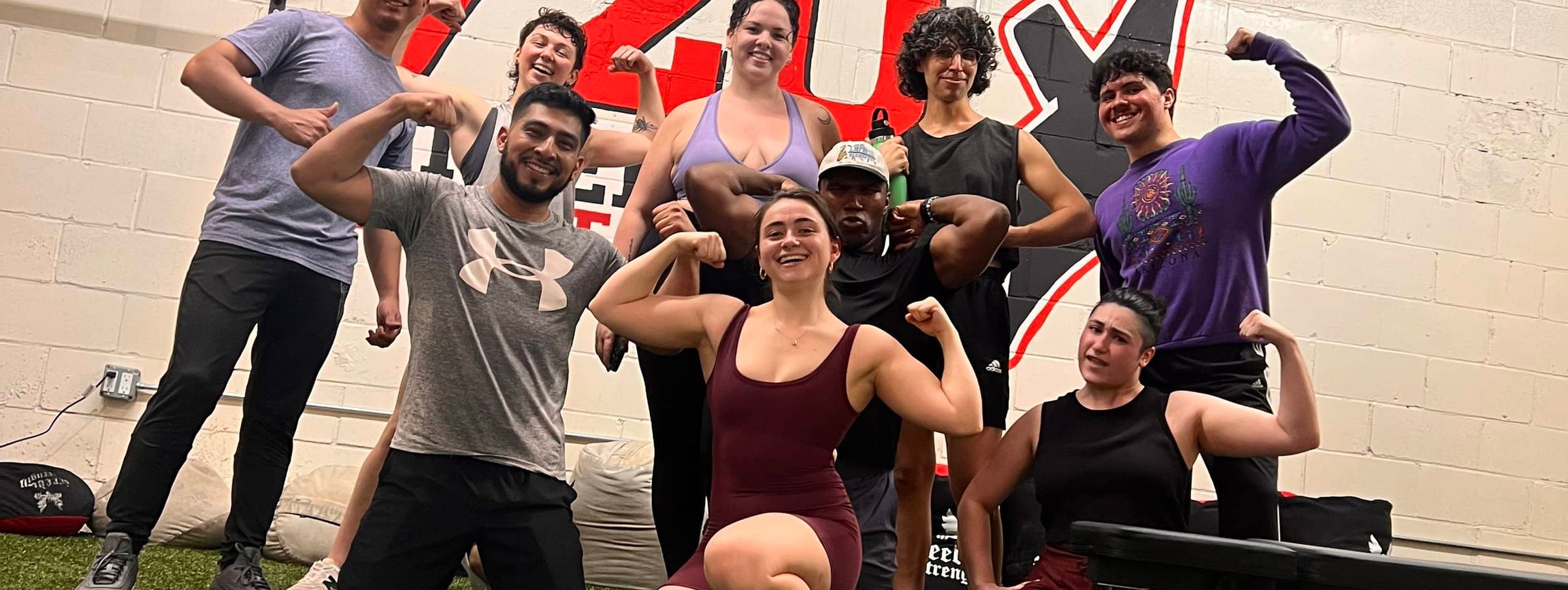 Training team posing after workout