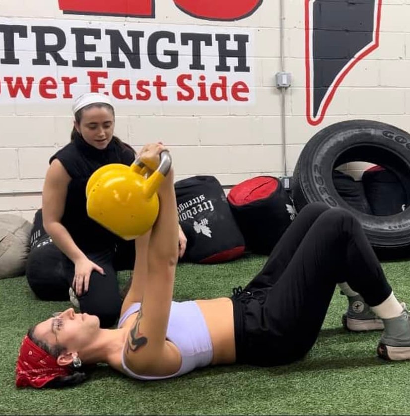 Athlete lifting barbell in gym